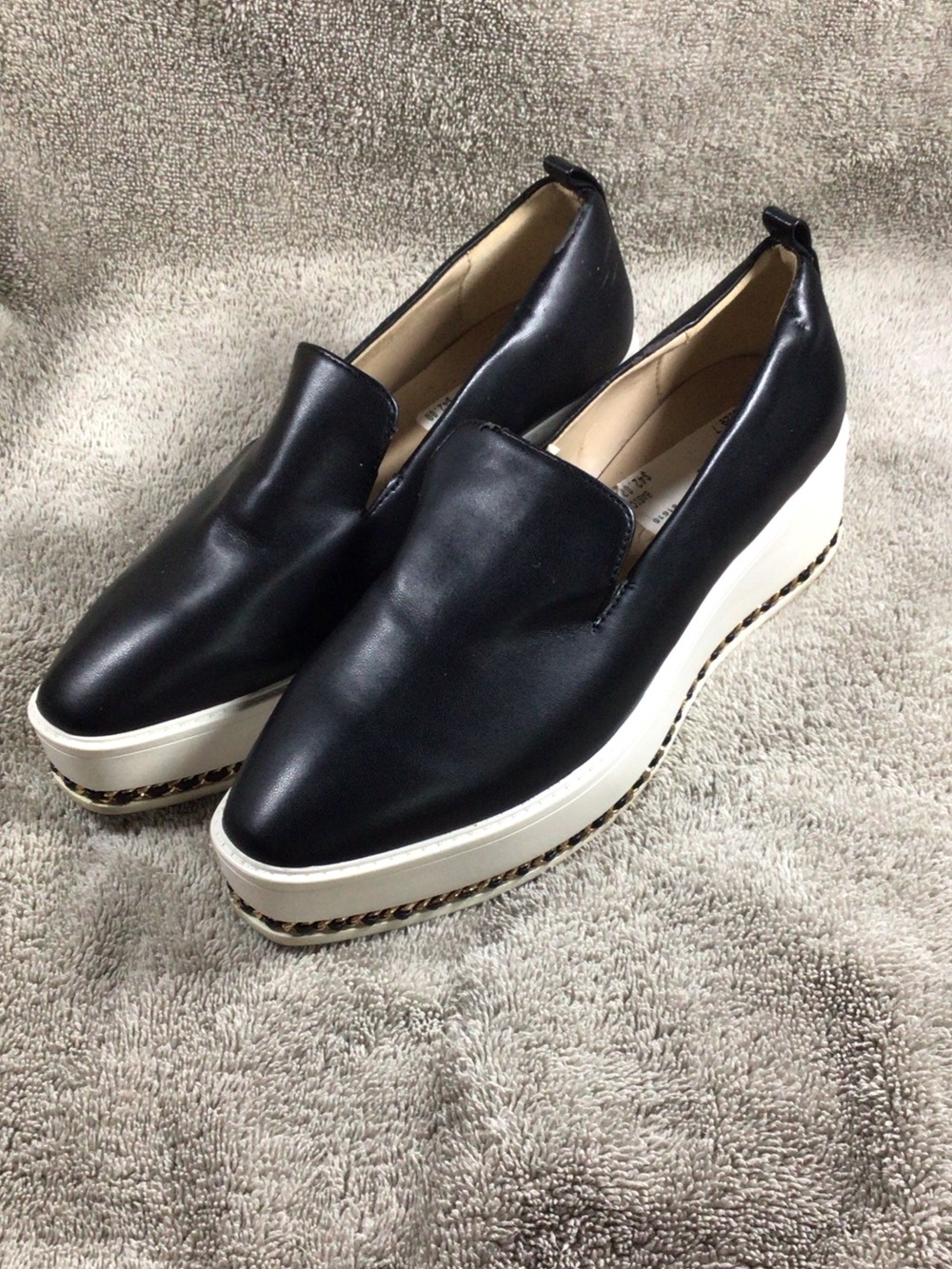 Karl Lagerfeld slip-on sneaker, studs along sole, black and white, size 7